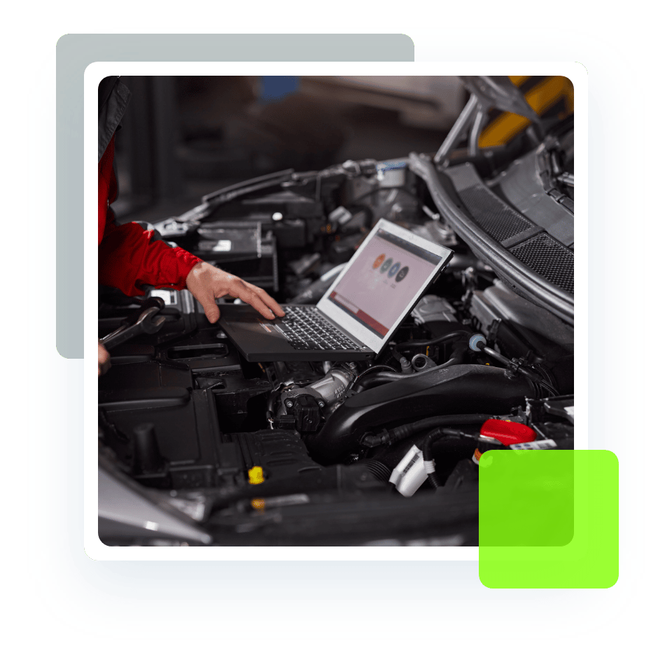 Image of an auto technician running diagnostics on a car using a laptop and tools. Concept image of vehicle diagnostics at Quality Car Care in North Liberty, IA.