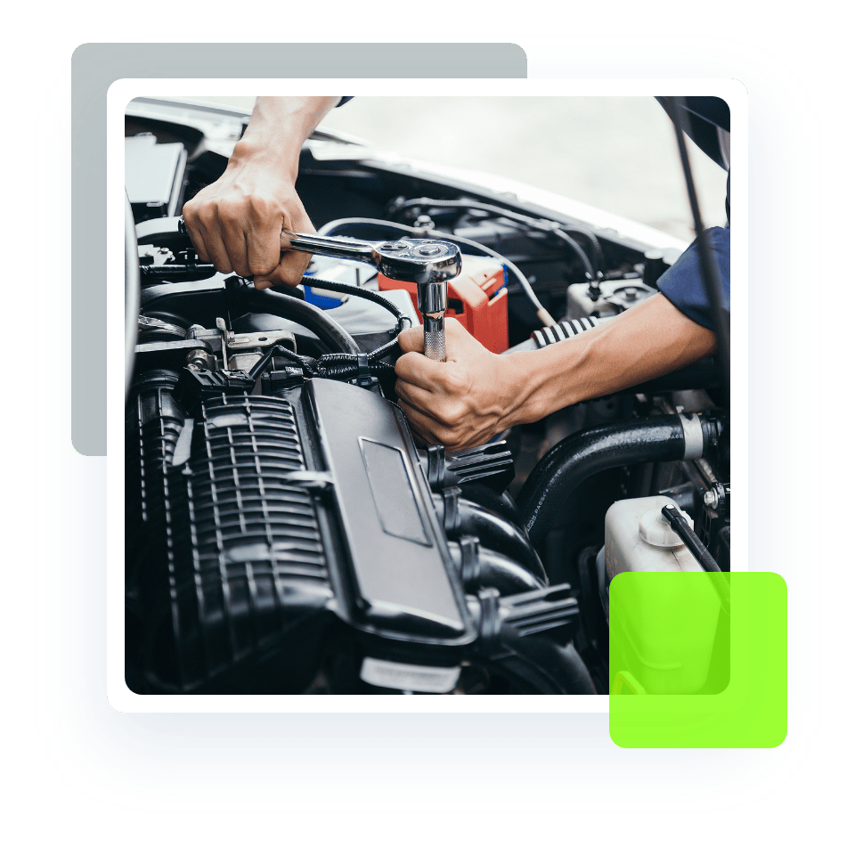 Image of an auto mechanic fixing a car engine. Concept image of engine services and repair at Quality Car Care in North Liberty, IA.