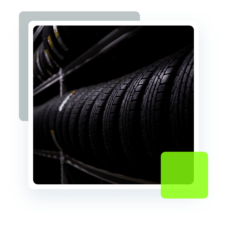 Image of row of tires on a shelf. Concept image of new tires and other tire services at Quality Car Care in North Liberty, IA.