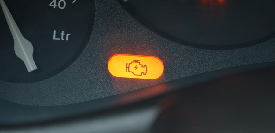 Orange check engine light indicating that there is a fault in the car. Concept image of “Why You Should Never Ignore Your Check Engine Light” | Quality Car Care in North Liberty, IA.