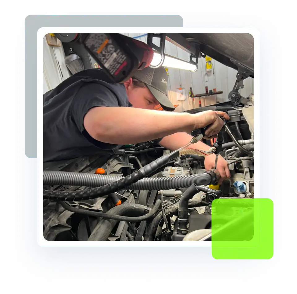 Engine Repair, Auto Repair Services in North Liberty IA At Quality Car Care. a man working on a car.